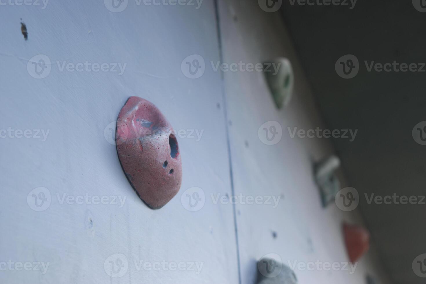 Several colorful climbing steps on a climbing board photo