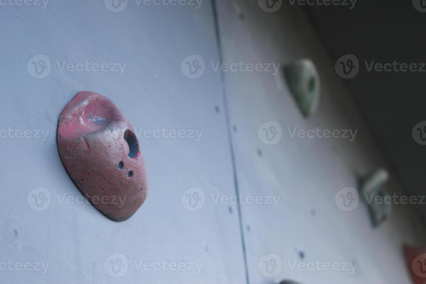 Several colorful climbing steps on a climbing board photo