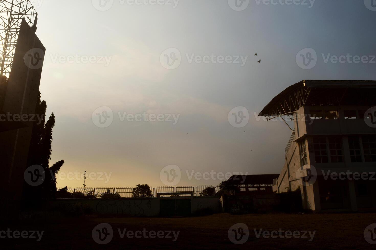 Silhouette photo of the atmosphere outside the football stadium in Brebes