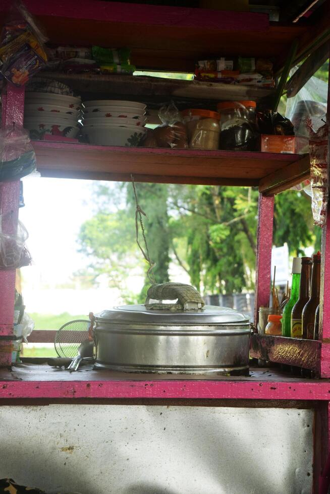 Carts of meatballs and several sachets of drinks used by traders to sell food photo