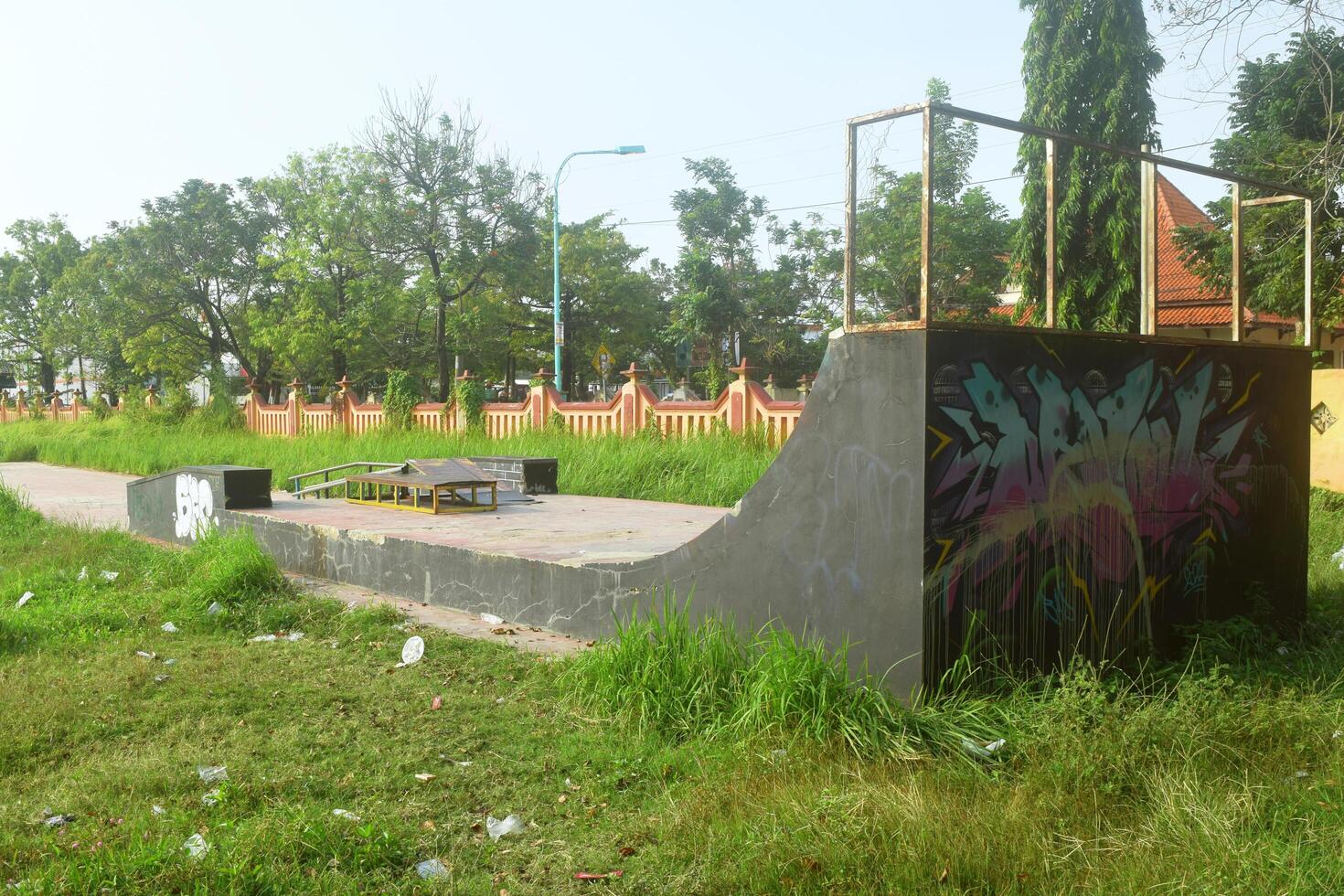 Brebes, Indonesia, 2023 - Rear view shot of a graffiti covered skater vanue in Brebes photo