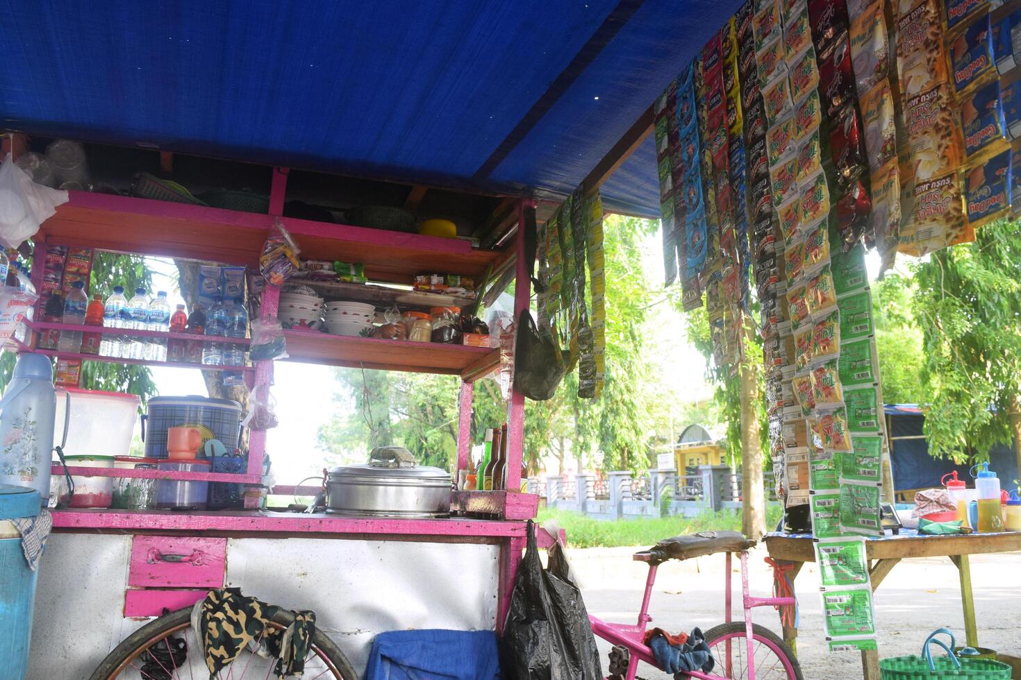 Carts of meatballs and several sachets of drinks used by traders to sell food photo