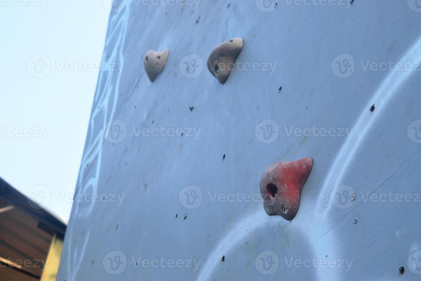 Several colorful climbing steps on a climbing board photo