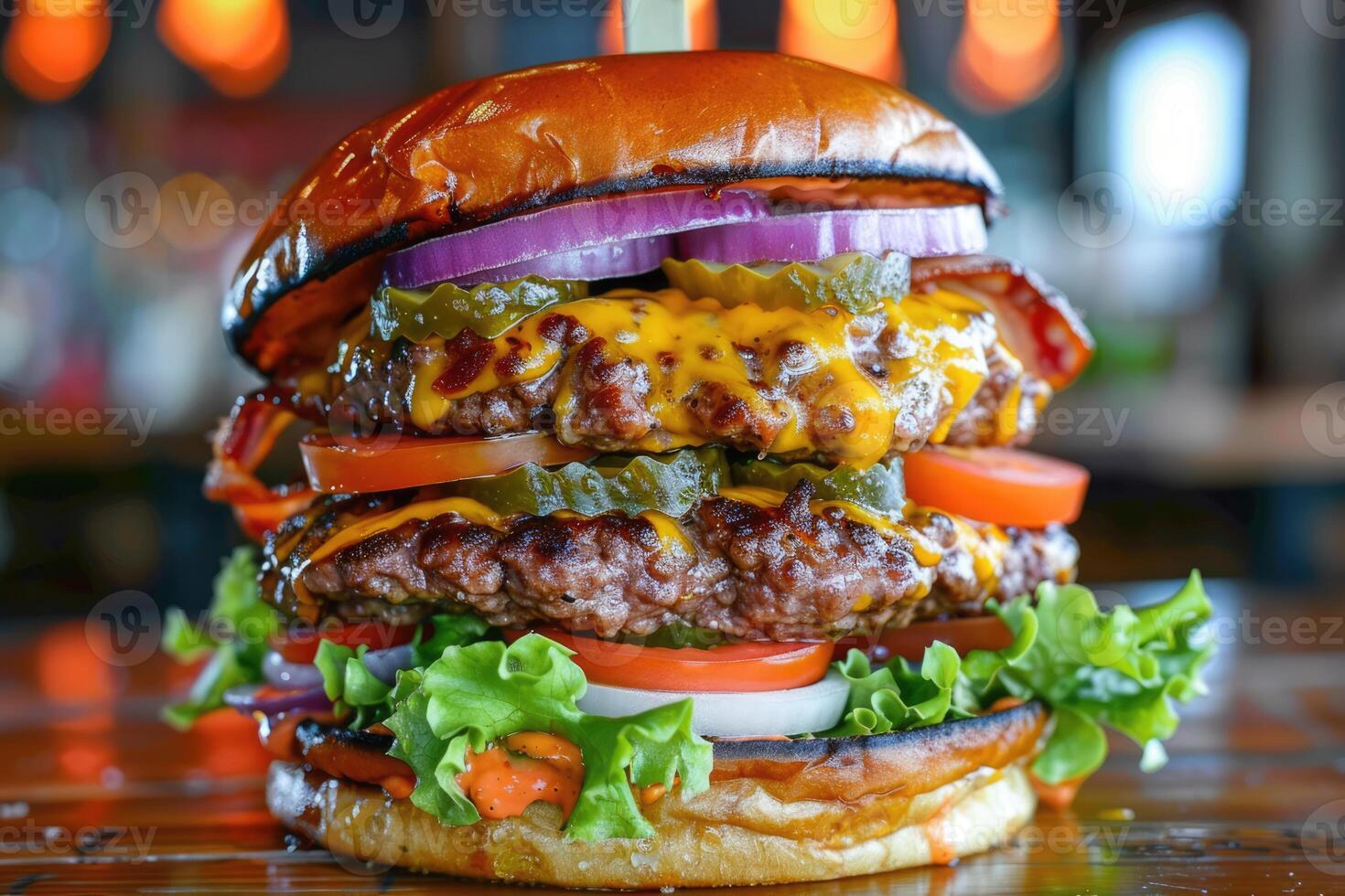 Layered juicy double cheeseburger with fresh lettuce, tomatoes, onions, pickles and melted cheese on the table, gourmet fast food, restaurant menu photo