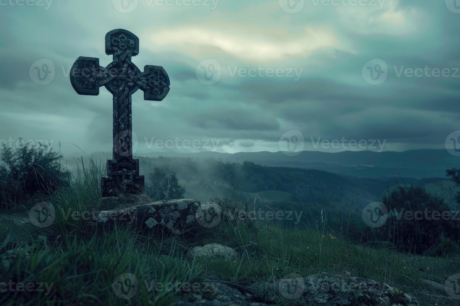 Ancient cross on the hill with dark clouds in the grey sky. Gothic scary atmosphere photo