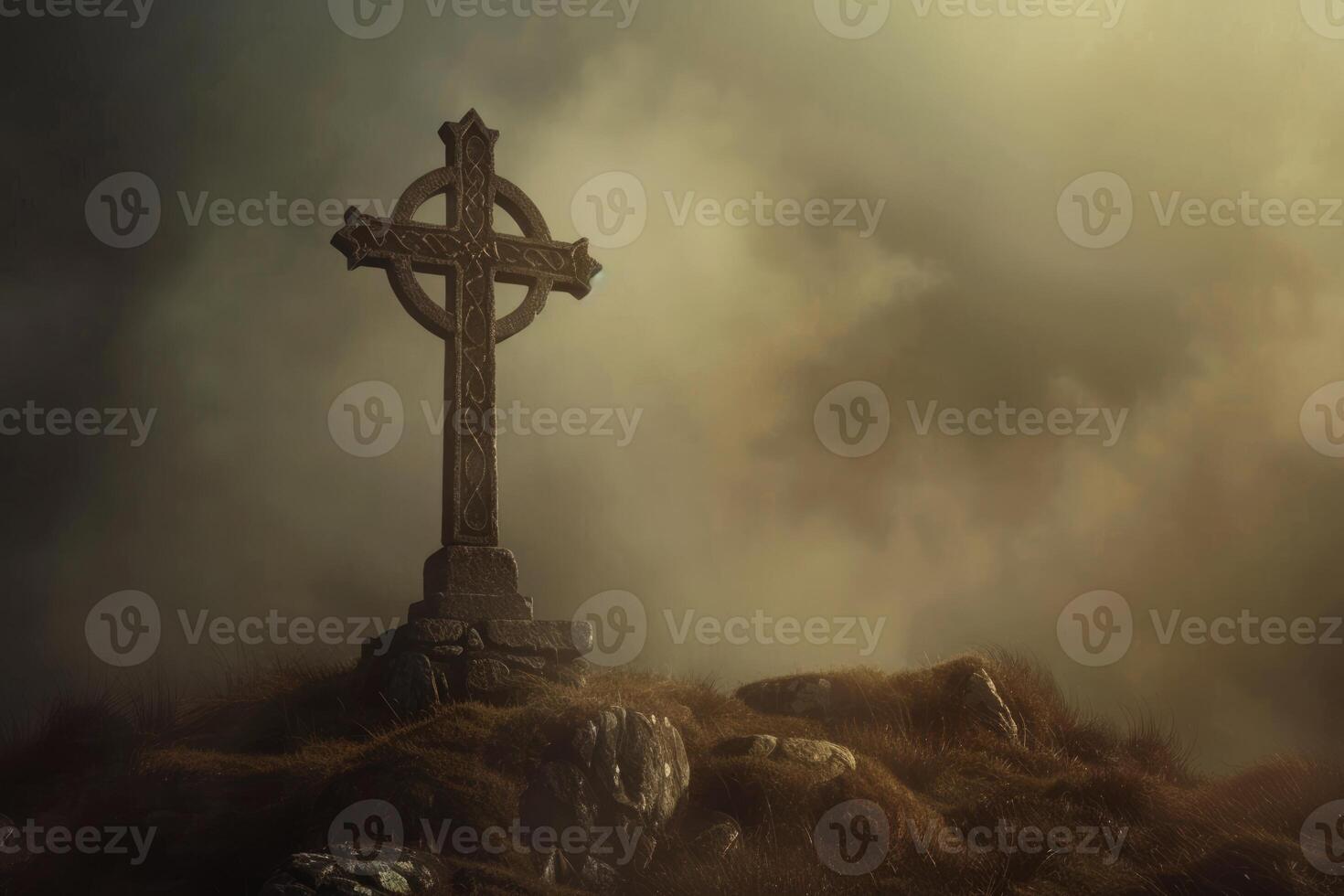 Celtic cross on the hill with dark clouds in the grey sky. Ancient gothic scary atmosphere photo