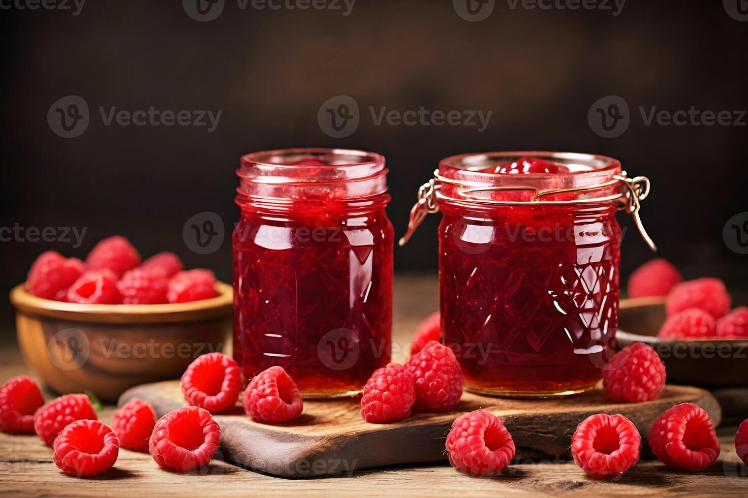 Raspberry jam, marmalade and fresh raspberries on a wooden tableRaspberry jam, marmalade and fresh raspberries on a wooden table photo