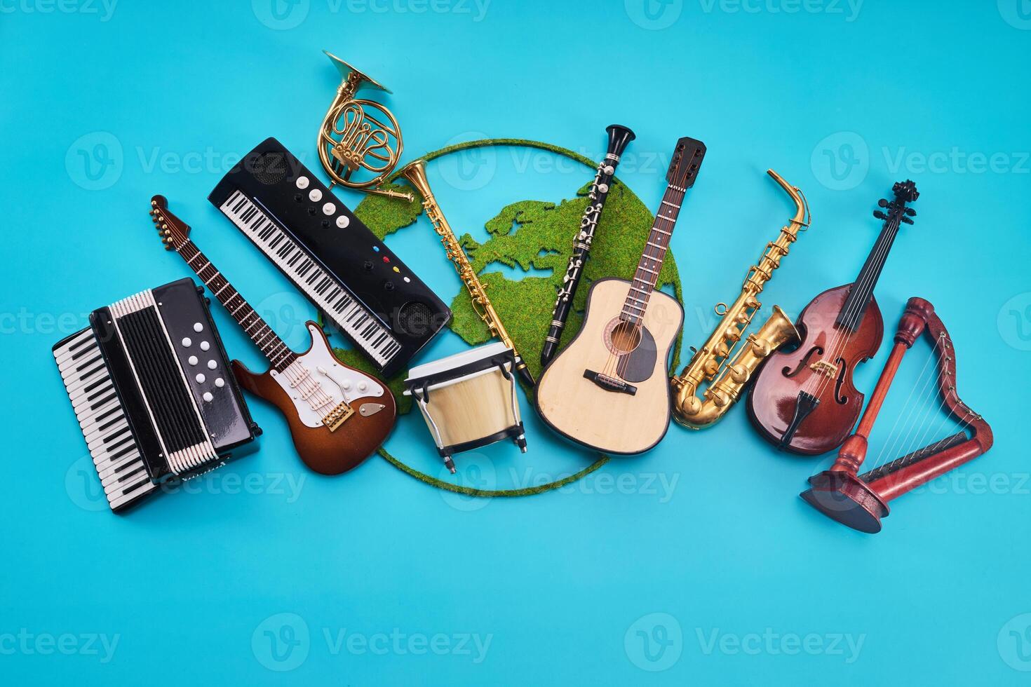 World Music Day. Assortment of Musical Instruments with world map on Blue background photo