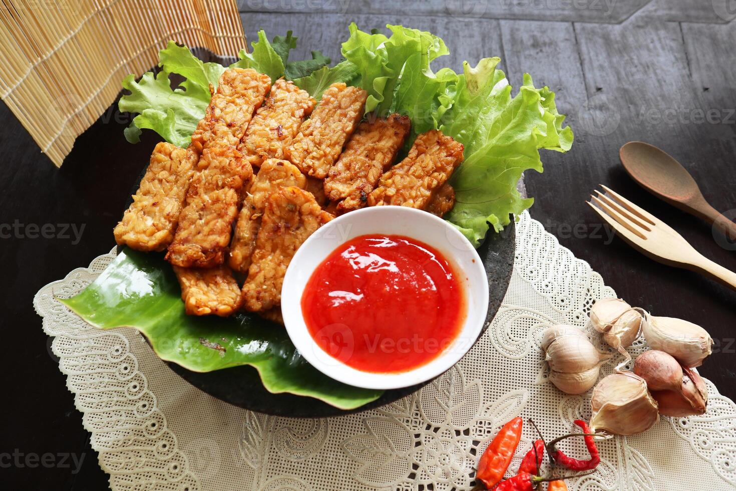 Tempeh Tempe Goreng or Fried tempeh is Indonesia traditional food, made from fermented soybean seeds photo