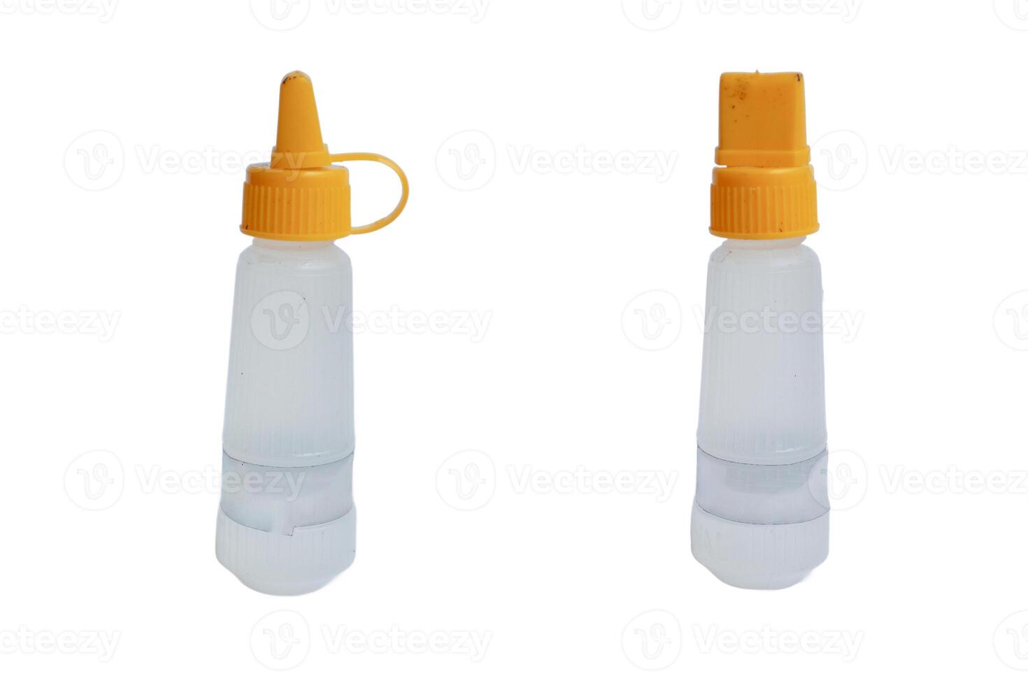 glue papper. liquid glue, streaming light transparent liquid. isolated on white background photo