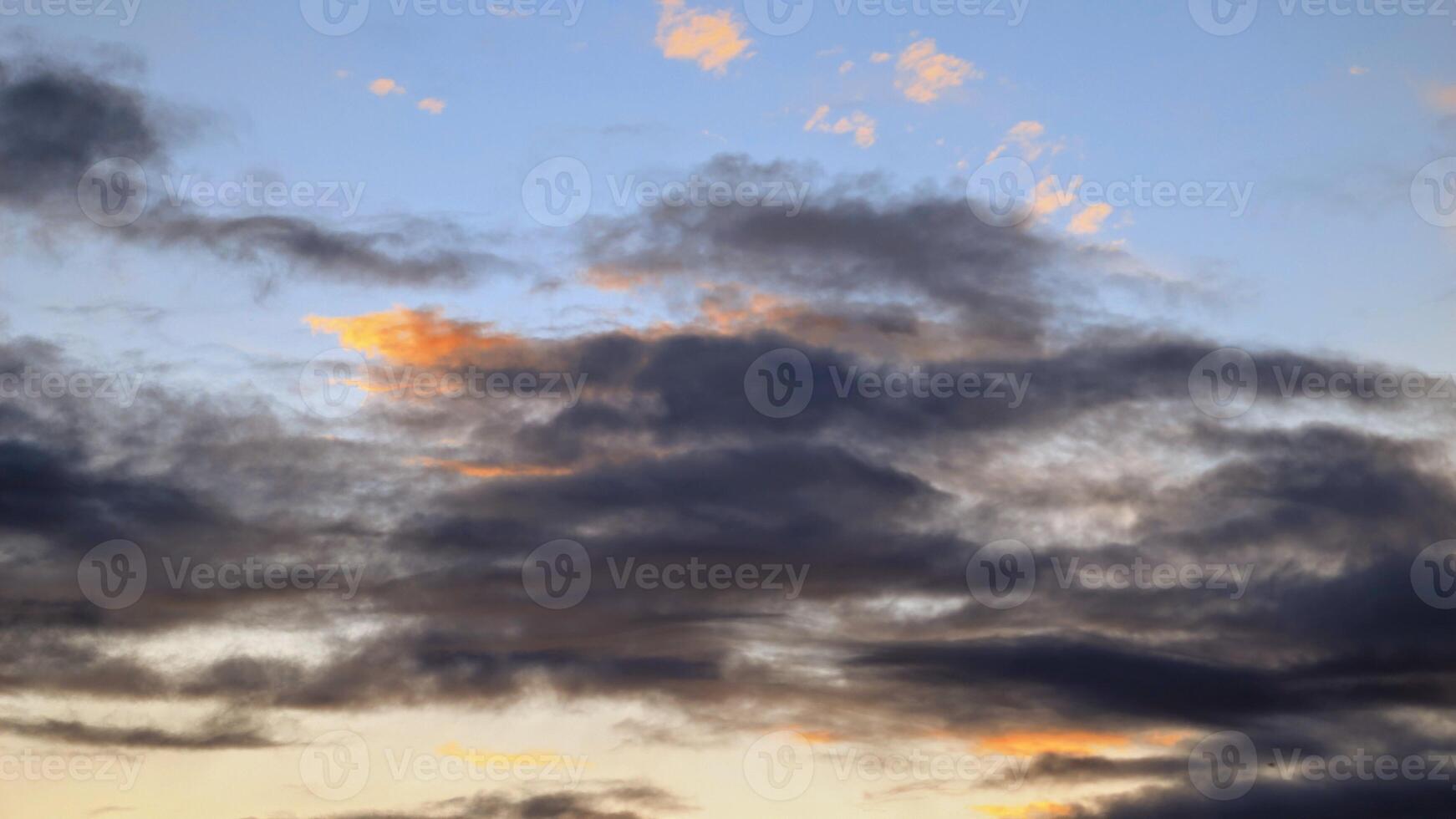 Cloudy sunset dramatic skies background, evening colourful sky template, painted clouds wallpaper photo