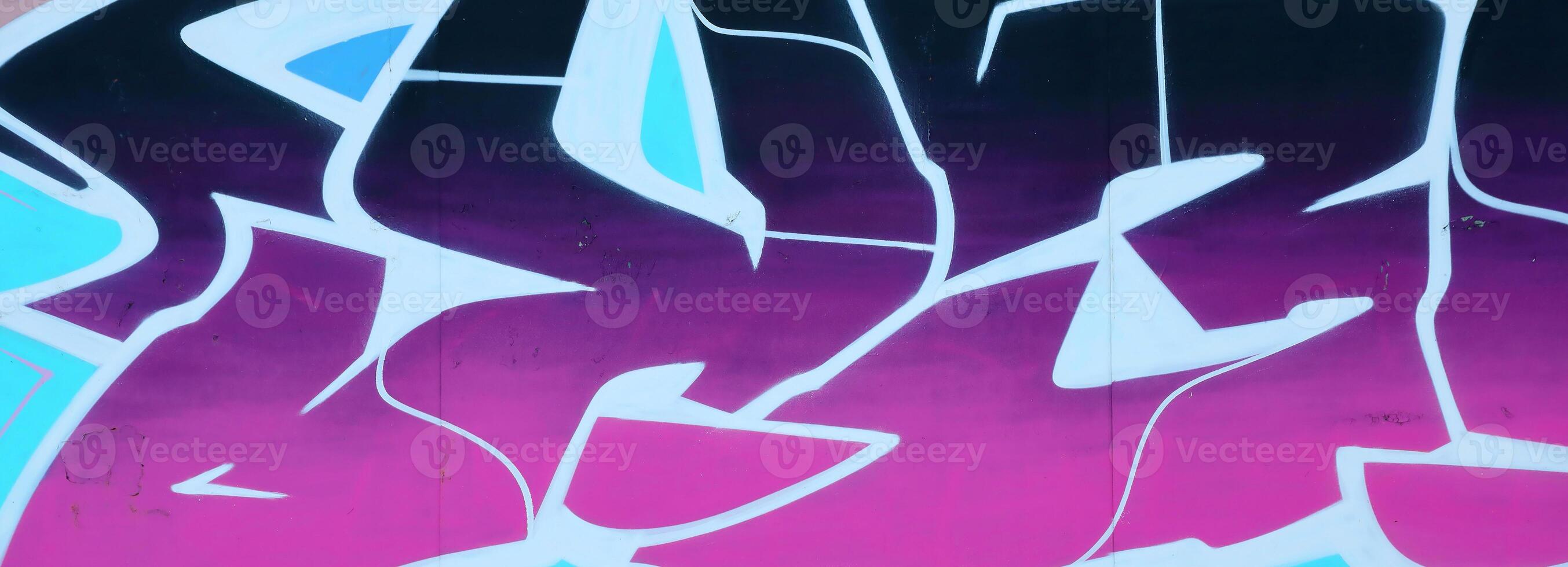 Colorful background of graffiti painting artwork with bright aerosol outlines on wall. Old school street art piece made with aerosol spray paint cans. Contemporary youth culture photo