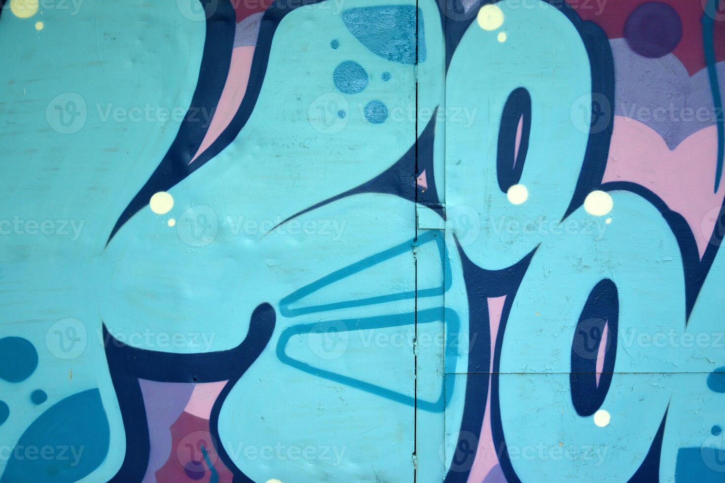 Colorful background of graffiti painting artwork with bright aerosol outlines on wall. Old school street art piece made with aerosol spray paint cans. Contemporary youth culture photo