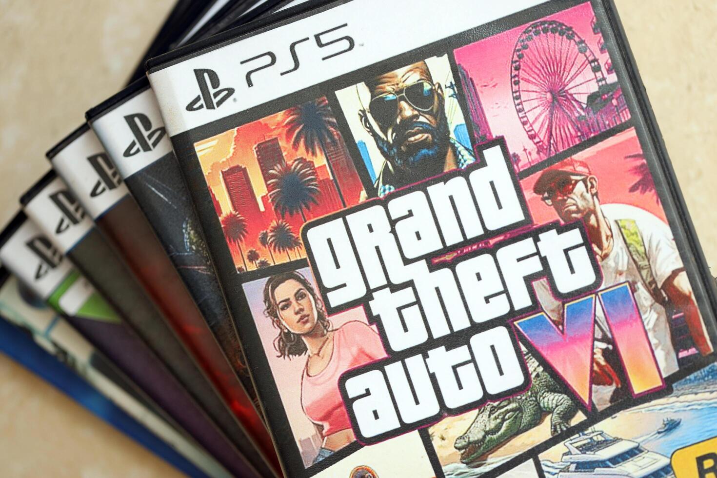 KYIV, UKRAINE - JUNE 26, 2024 Grand Theft Auto 6 PS5 game disc box for console gaming. Fictional fan-made game disc pack cover photo