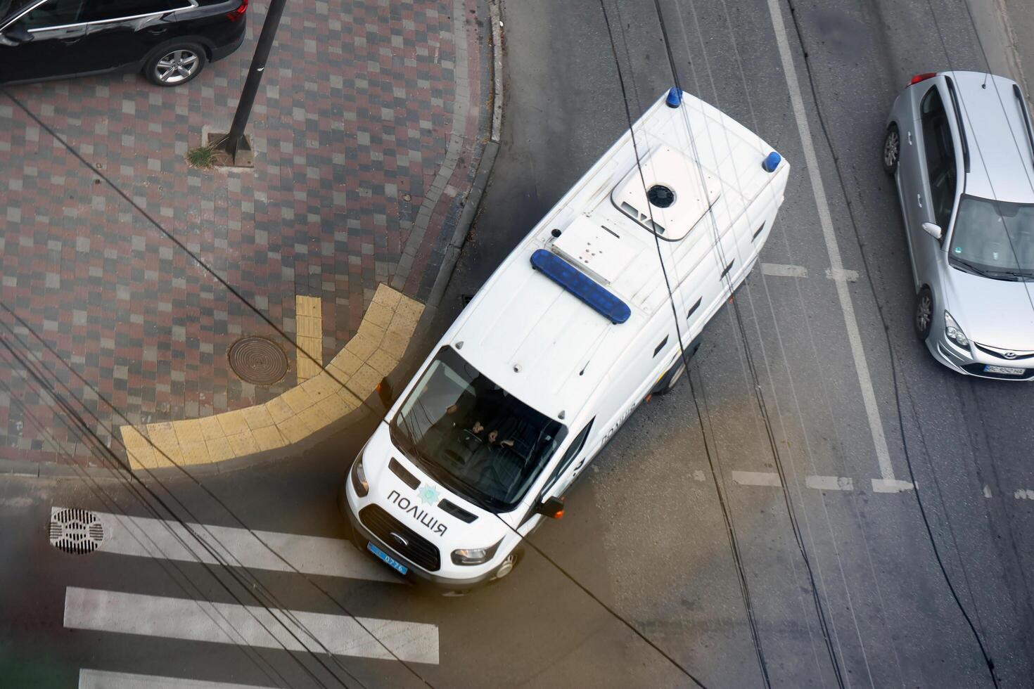 TERNOPIL, UKRAINE - JULY 7, 2023 Ukrainian patrol police white car with police lights and decals in daytime photo