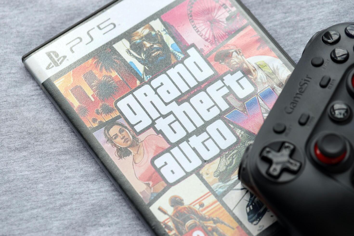 KYIV, UKRAINE - JUNE 26, 2024 Grand Theft Auto 6 PS5 game disc box for console gaming. Fictional fan-made game disc pack cover photo