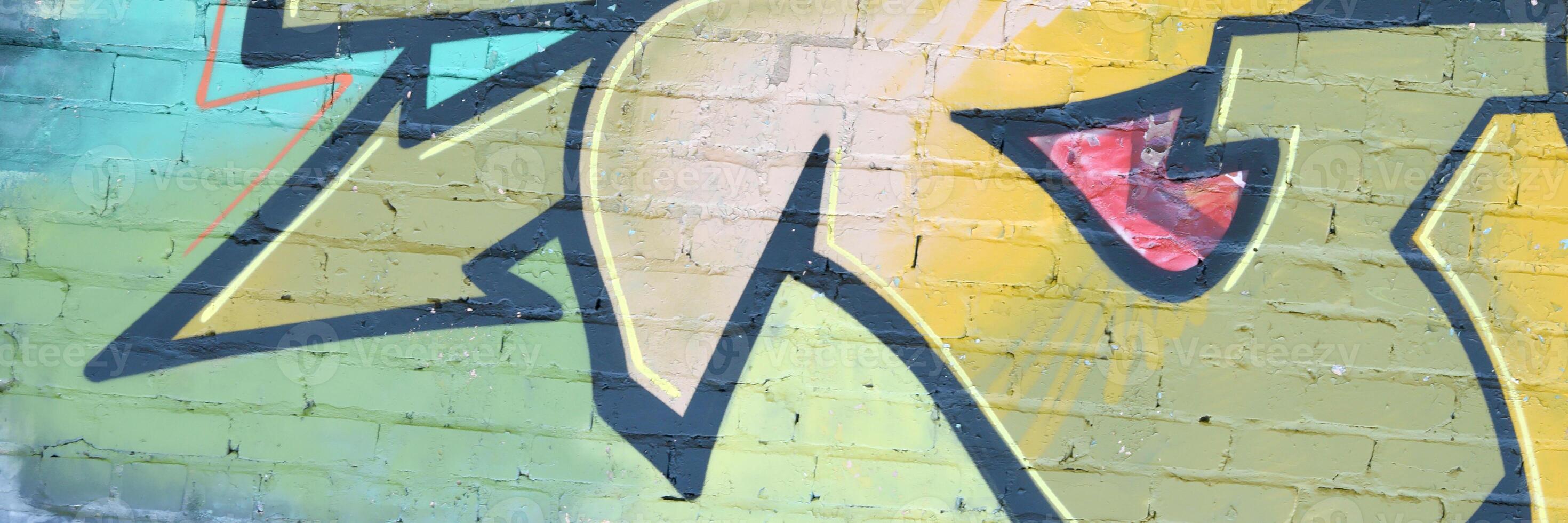 Colorful background of graffiti painting artwork with bright aerosol outlines on wall. Old school street art piece made with aerosol spray paint cans. Contemporary youth culture photo