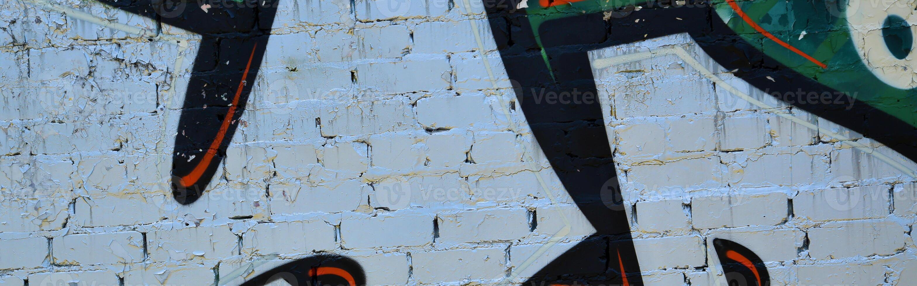 Colorful background of graffiti painting artwork with bright aerosol outlines on wall. Old school street art piece made with aerosol spray paint cans. Contemporary youth culture photo