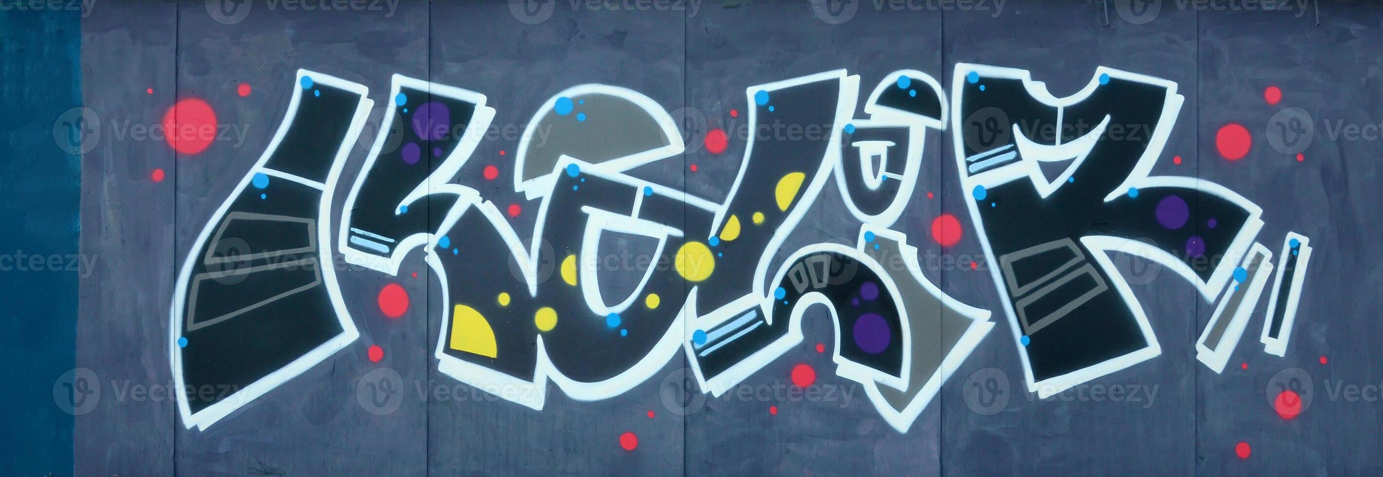 Colorful background of graffiti painting artwork with bright aerosol outlines on wall. Old school street art piece made with aerosol spray paint cans. Contemporary youth culture photo