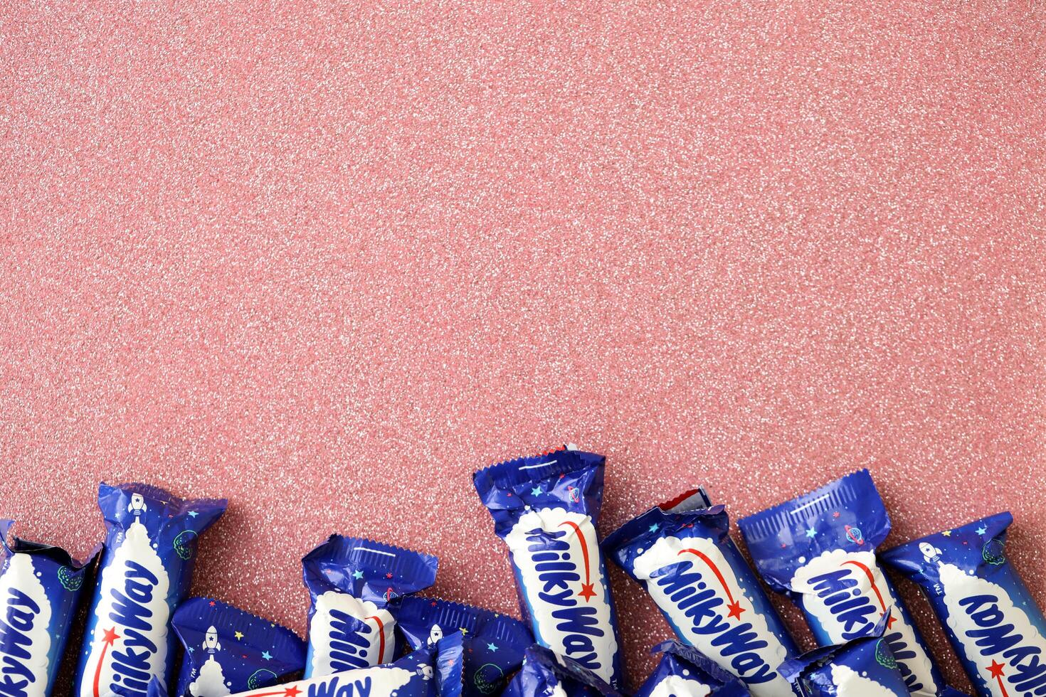 KYIV, UKRAINE - APRIL 20, 2024 Milky Way or MilkyWay small chocolate bars. Milky Way bars is worldwide famous product photo