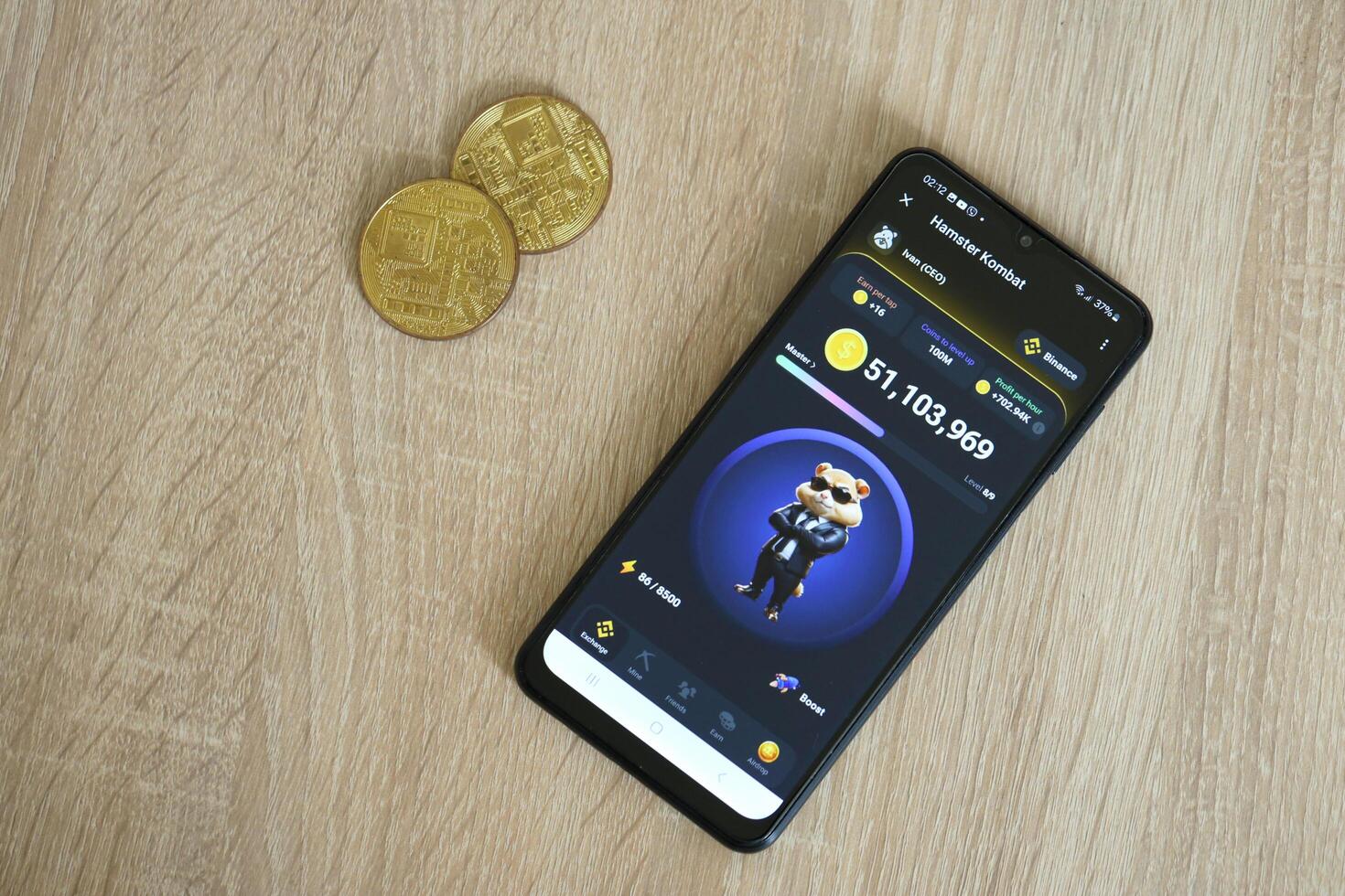 KYIV, UKRAINE - APRIL 20, 2024 Hamster Kombat telegram bot on smartphone screen. Hamster Kombat is a viral Telegram crypto game for earn HMSTR tokens by managing virtual crypto exchange photo