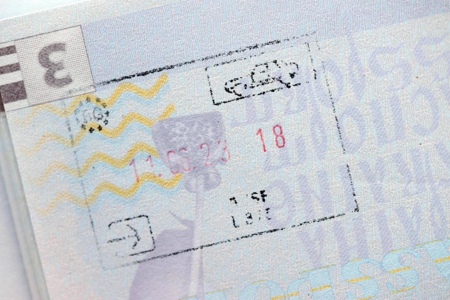 KYIV, UKRAINE - APRIL 20, 2024 Page of foreign passport with visas, Turkiye border stamps, permits to enter countries, concept of traveling around the world, travelers document photo