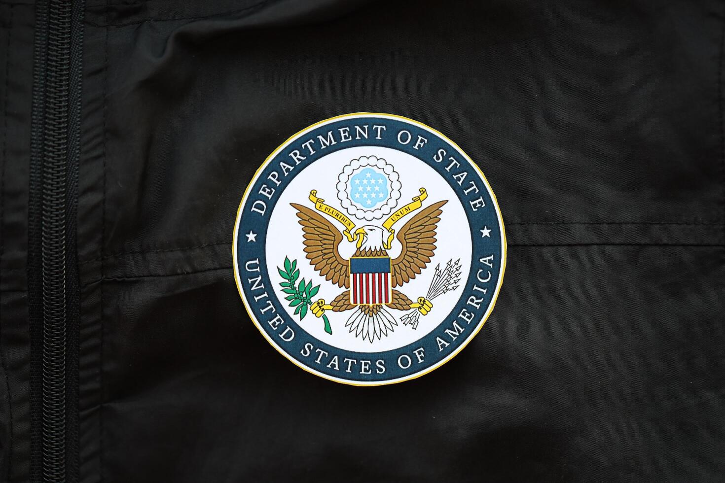 KYIV, UKRAINE - MARCH 9, 2024 US Department of State seal on black jacket uniform photo