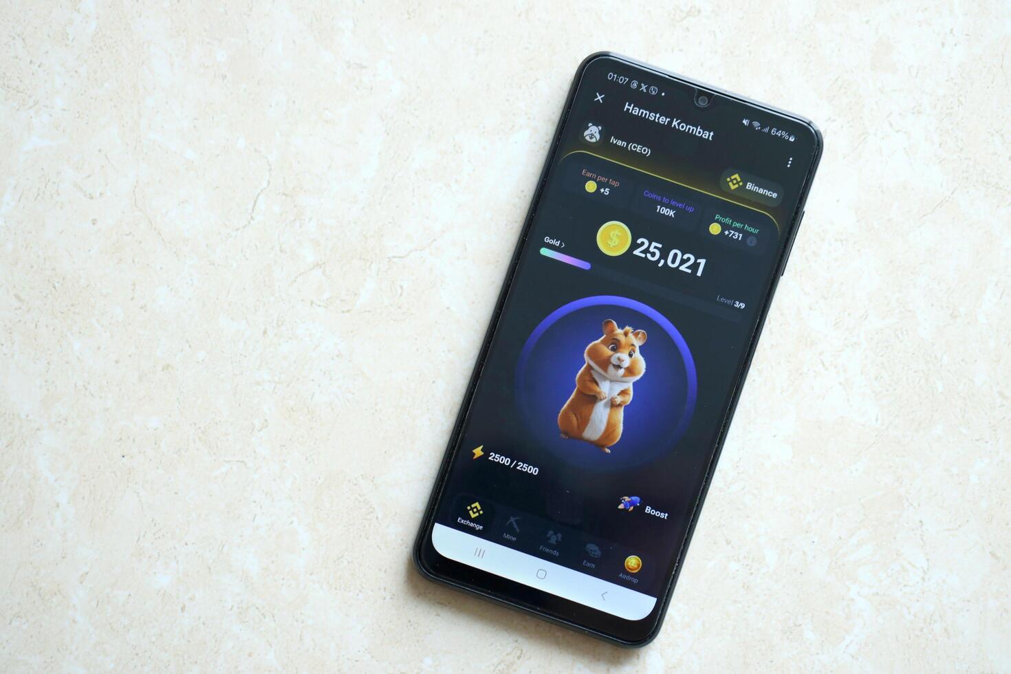 KYIV, UKRAINE - APRIL 20, 2024 Hamster Kombat telegram bot on smartphone screen. Hamster Kombat is a viral Telegram crypto game for earn HMSTR tokens by managing virtual crypto exchange photo