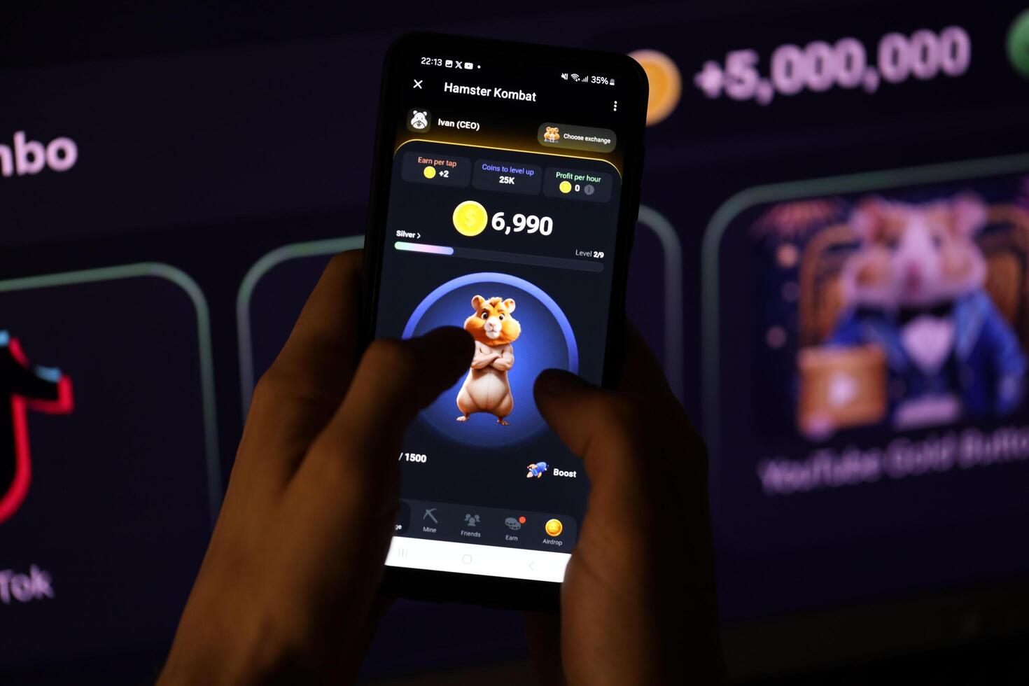 KYIV, UKRAINE - APRIL 20, 2024 Hamster Kombat telegram bot on smartphone screen. Hamster Kombat is a viral Telegram-based crypto game for earn HMSTR tokens by managing virtual crypto exchange photo