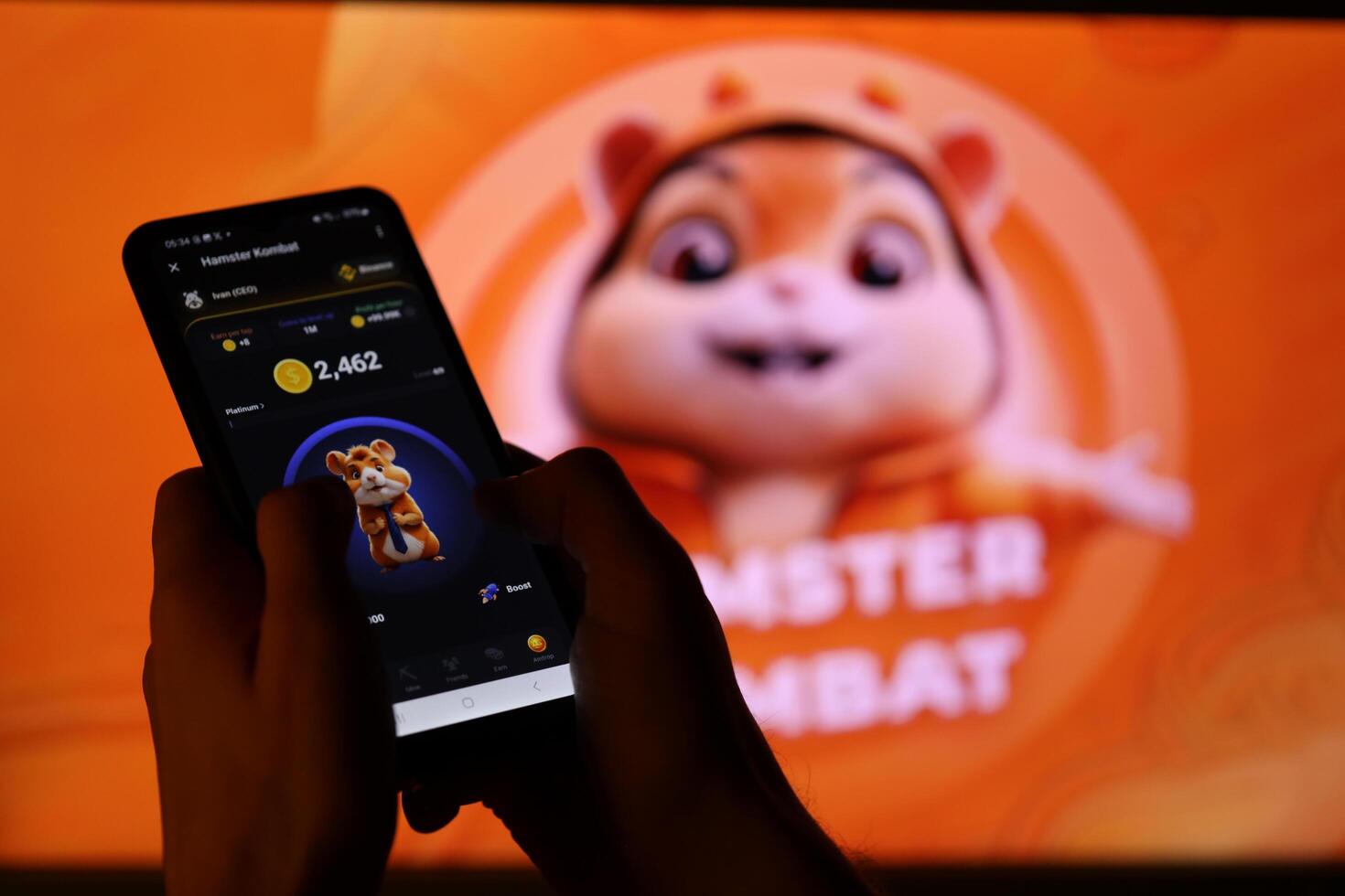 KYIV, UKRAINE - APRIL 20, 2024 Hamster Kombat telegram bot on smartphone screen. Hamster Kombat is a viral Telegram-based crypto game for earn HMSTR tokens by managing virtual crypto exchange photo