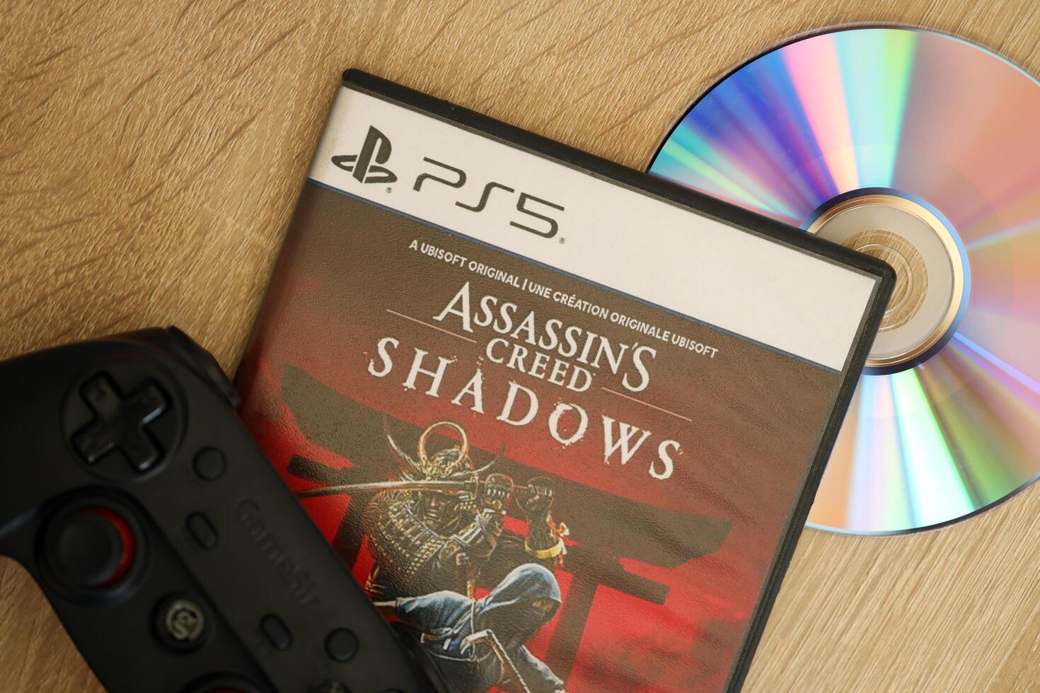 KYIV, UKRAINE - JUNE 26, 2024 Assassin's Creed Shadows PS5 game disc box for console gaming. Popular game disc photo