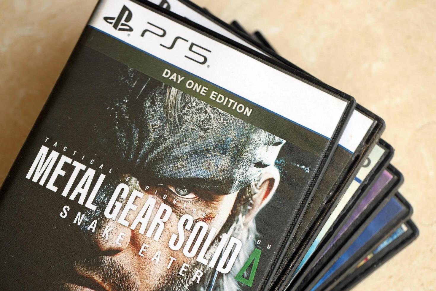 KYIV, UKRAINE - JUNE 26, 2024 Metal Gear Solid Delta Snake Eater PS5 game disc box for console gaming. Popular game disc photo