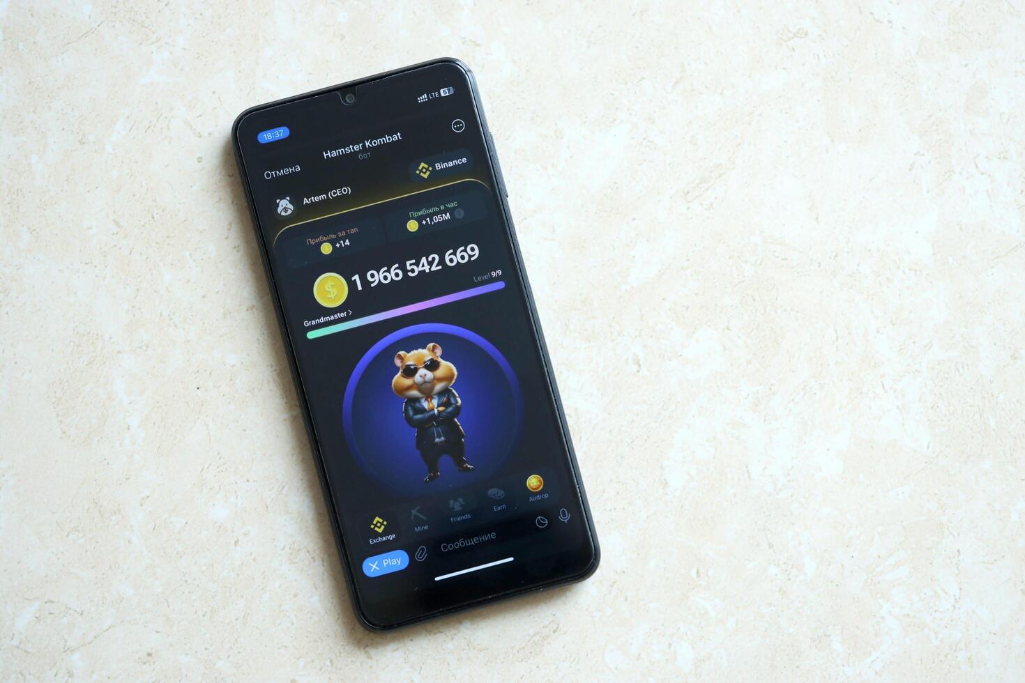 KYIV, UKRAINE - APRIL 20, 2024 Hamster Kombat telegram bot on smartphone screen. Hamster Kombat is a viral Telegram crypto game for earn HMSTR tokens by managing virtual crypto exchange photo