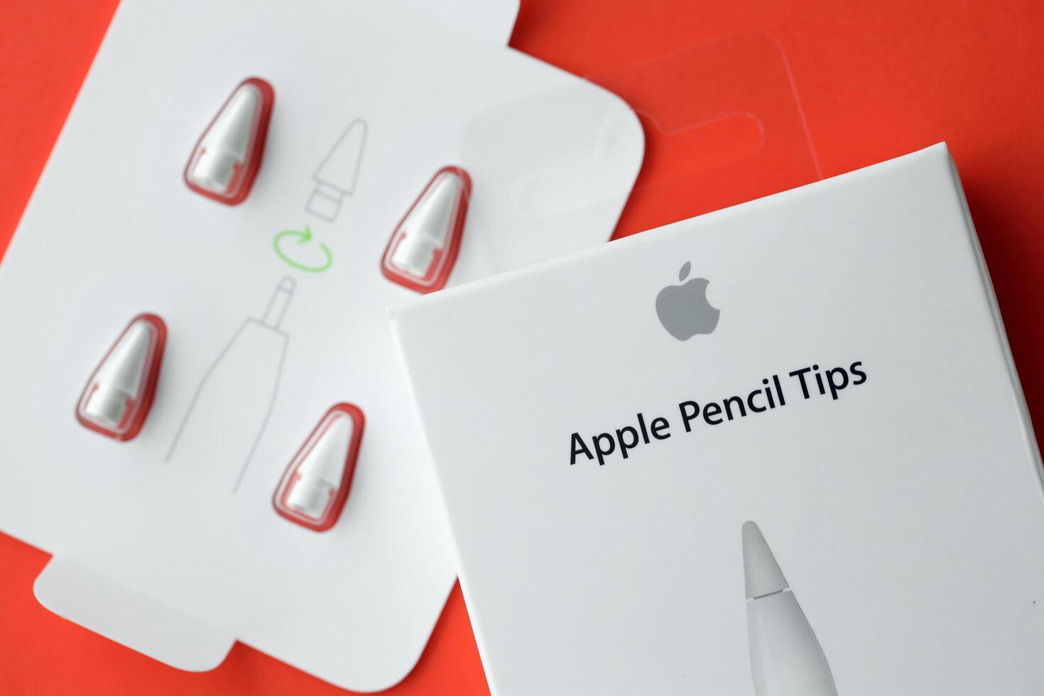 KYIV, UKRAINE - APRIL 20, 2024 Apple pencil tips for special apple pencil for drawing on iPad tablet on red background photo