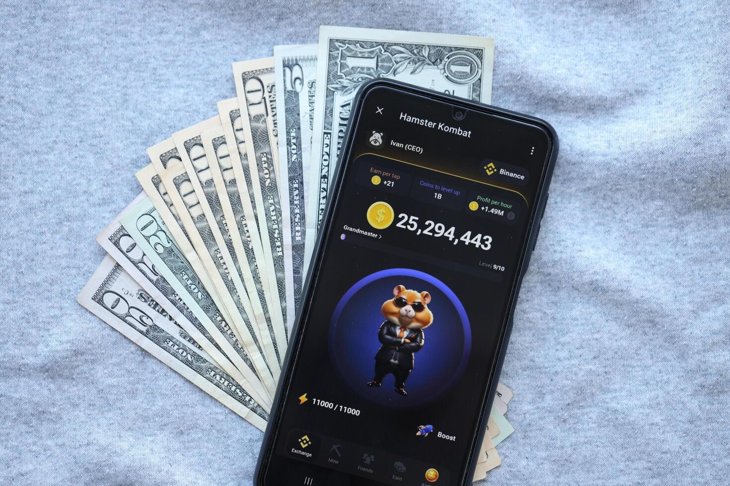 KYIV, UKRAINE - JUNE 20, 2024 Hamster Kombat tap 2 earn mini game in telegram messenger on smartphone display photo