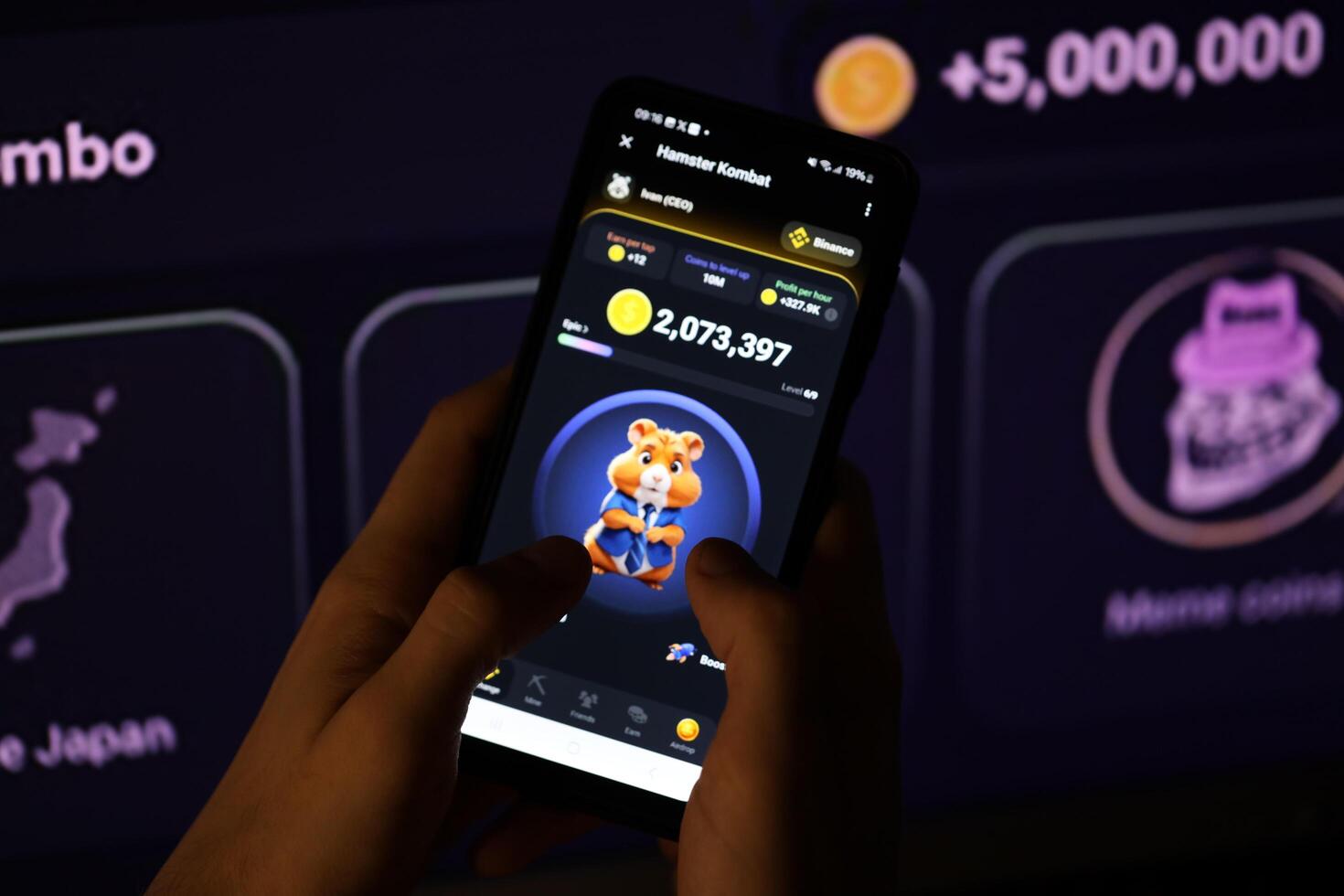KYIV, UKRAINE - APRIL 20, 2024 Hamster Kombat telegram bot on smartphone screen. Hamster Kombat is a viral Telegram-based crypto game for earn HMSTR tokens by managing virtual crypto exchange photo