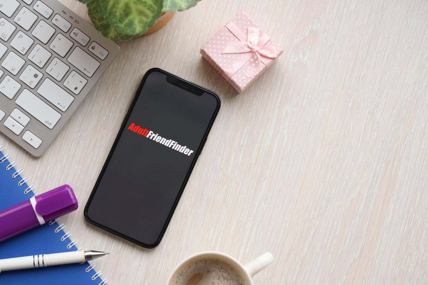 KYIV, UKRAINE - FEBRUARY 23, 2024 Adult Friend Finder logo of famous dating website or app on iPhone display photo