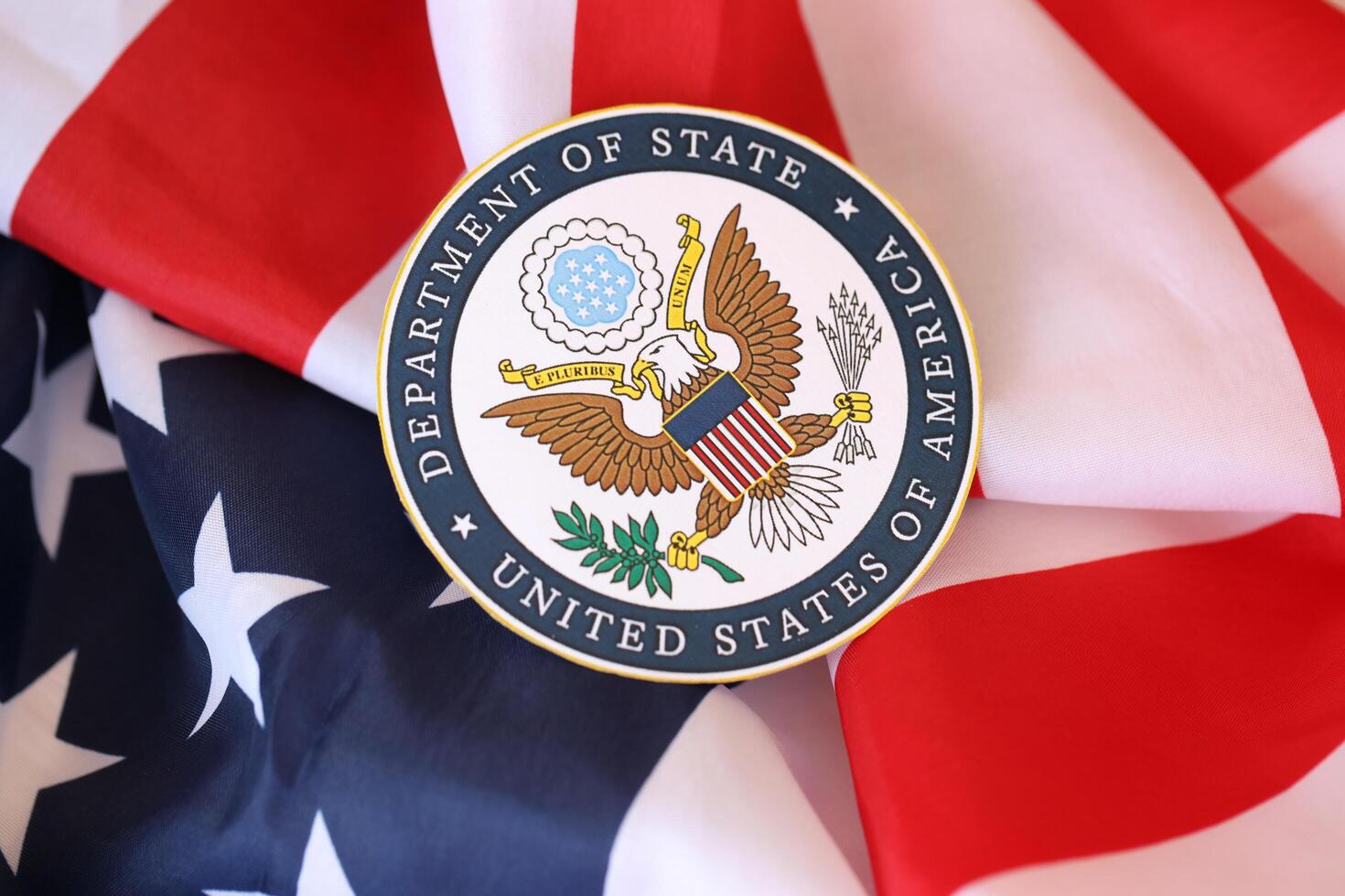 KYIV, UKRAINE - MARCH 9, 2024 US Department of State seal on United States of America flag photo
