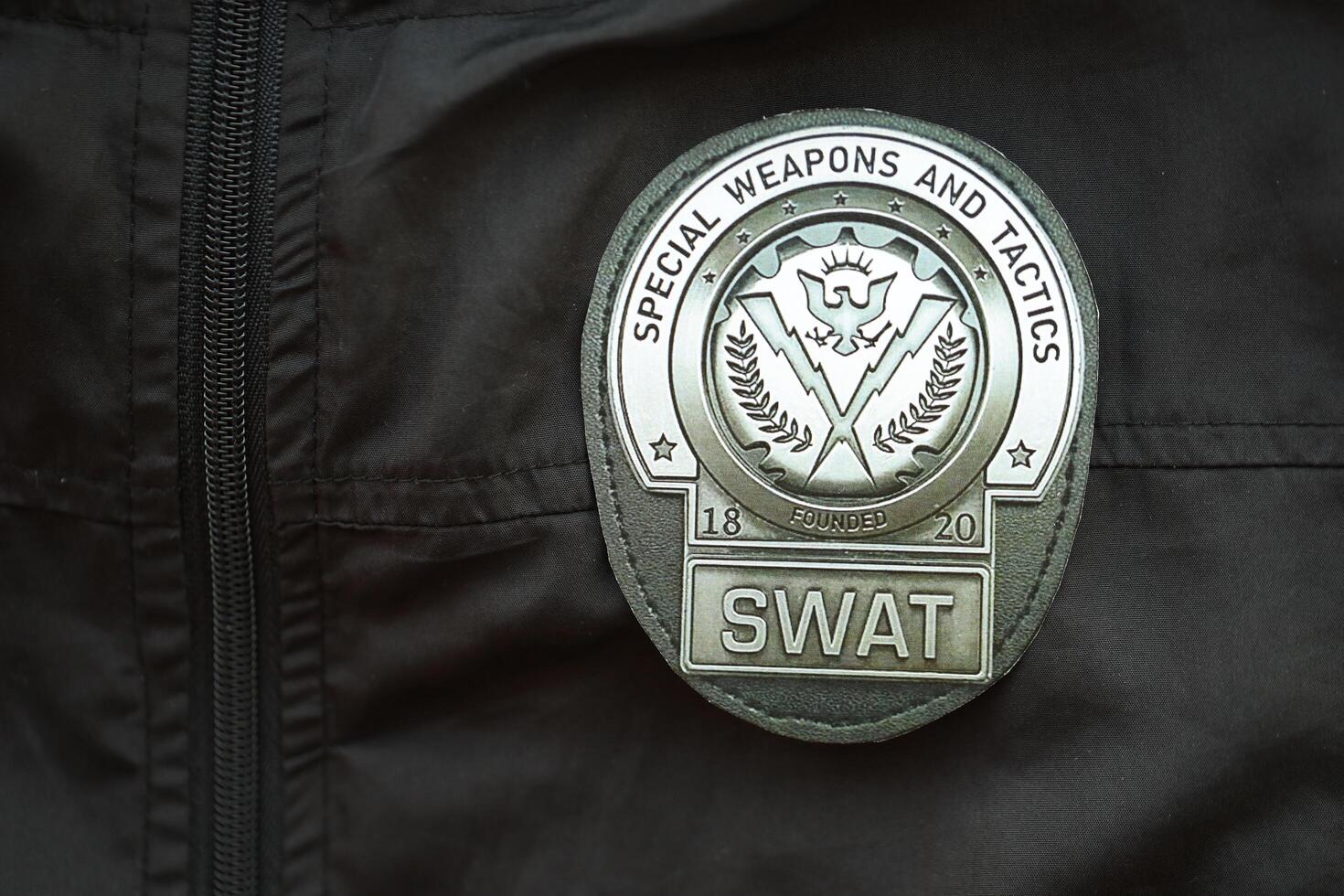 KYIV, UKRAINE - MARCH 9, 2024 US SWAT badge on black jacket uniform photo