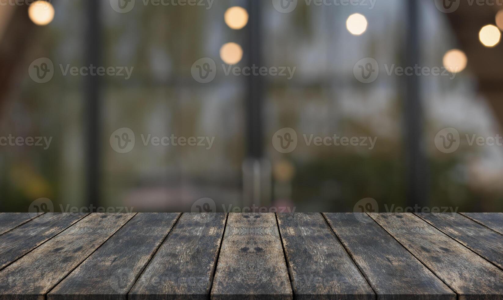 Empty wooden table top with lights bokeh on blur restaurant background. photo