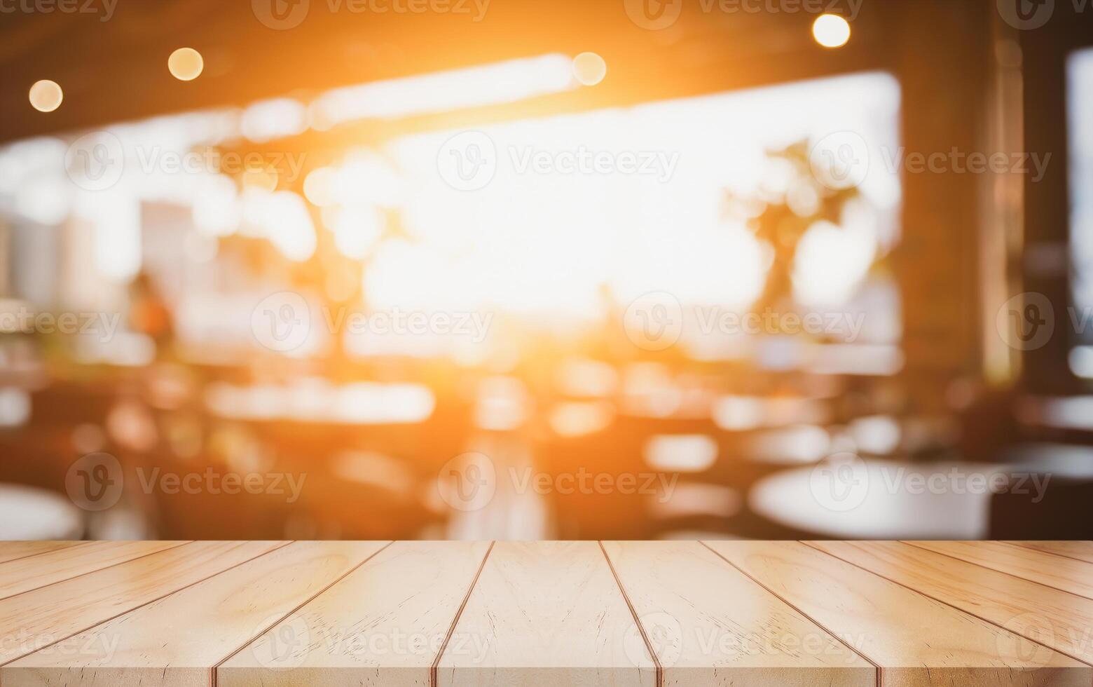 Empty wooden table top with lights bokeh on blur restaurant background. photo