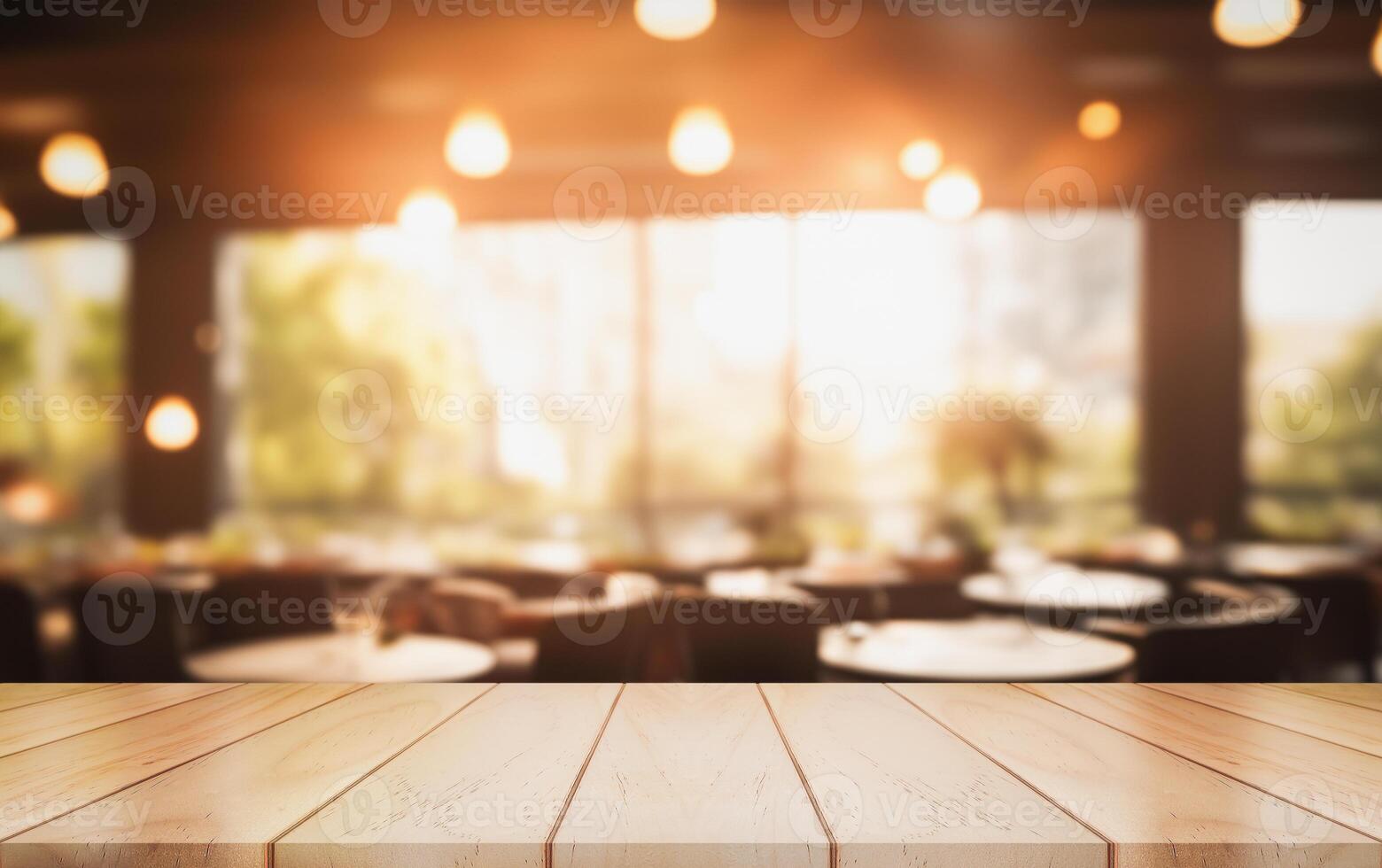 Empty wooden table top with lights bokeh on blur restaurant background. photo