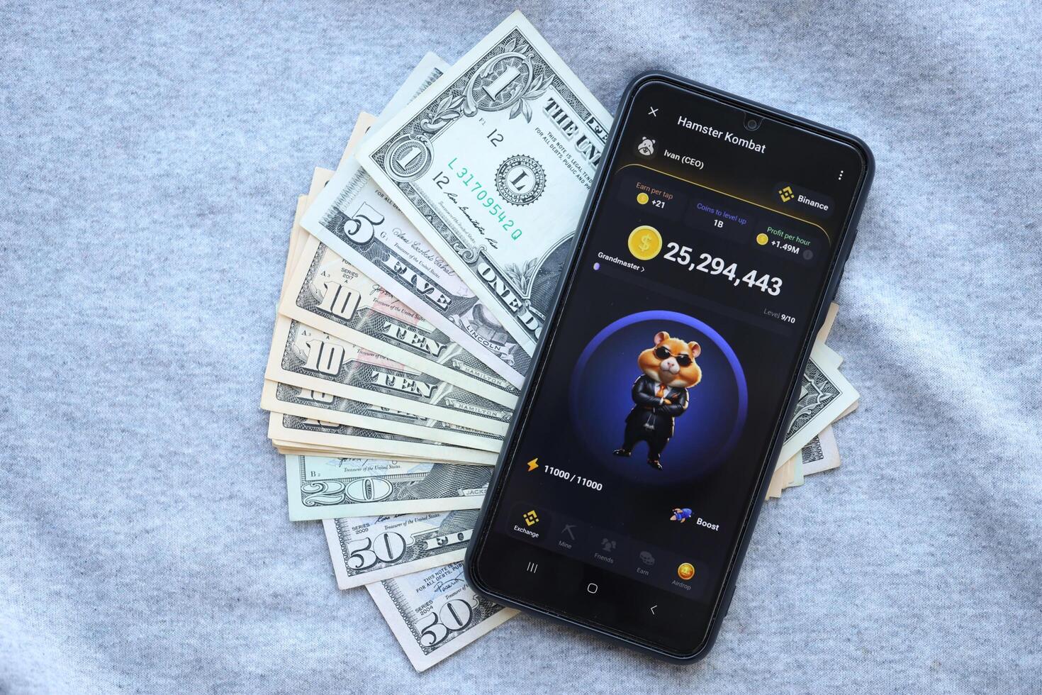 KYIV, UKRAINE - JUNE 20, 2024 Hamster Kombat tap 2 earn mini game in telegram messenger on smartphone display photo