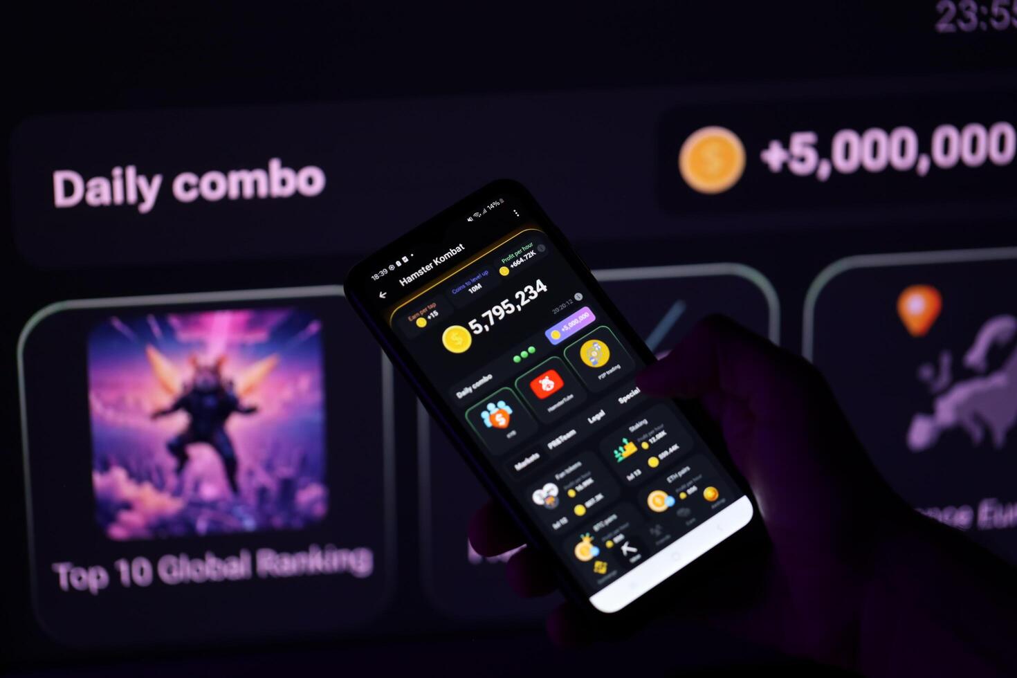 KYIV, UKRAINE - APRIL 20, 2024 Hamster Kombat telegram bot on smartphone screen. Hamster Kombat is a viral Telegram-based crypto game for earn HMSTR tokens by managing virtual crypto exchange photo