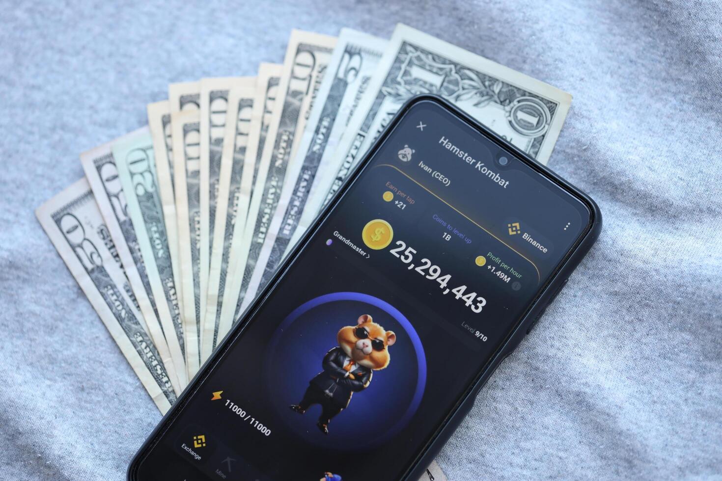KYIV, UKRAINE - JUNE 20, 2024 Hamster Kombat tap 2 earn mini game in telegram messenger on smartphone display photo
