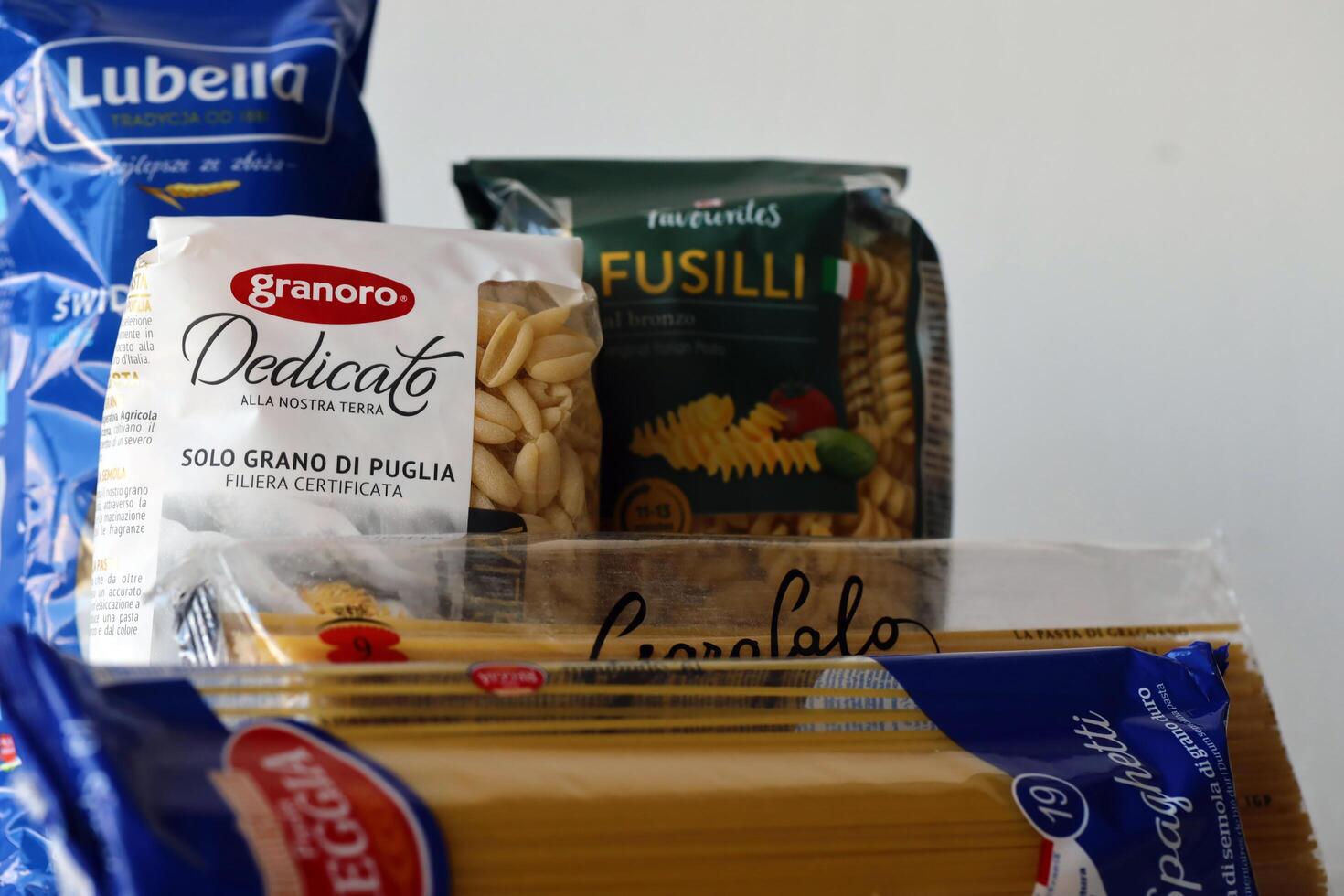 KYIV, UKRAINE - 4 MAY, 2023 Few packs of italian macaroni from differend famous brands and manufacturers photo