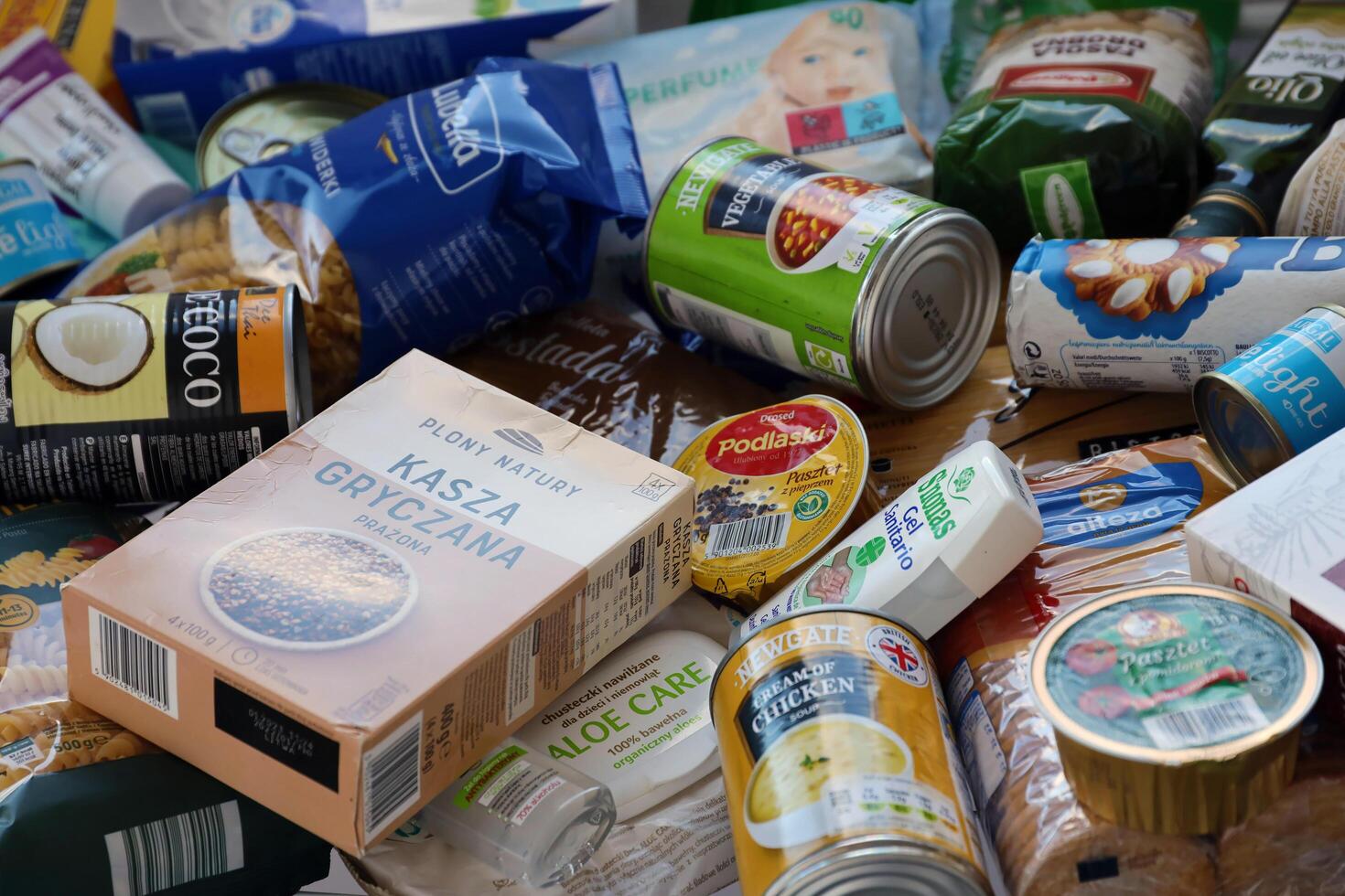 KYIV, UKRAINE - 4 MAY, 2023 Big stack of humanitarian aid food and products from europe to ukrainian refugees photo