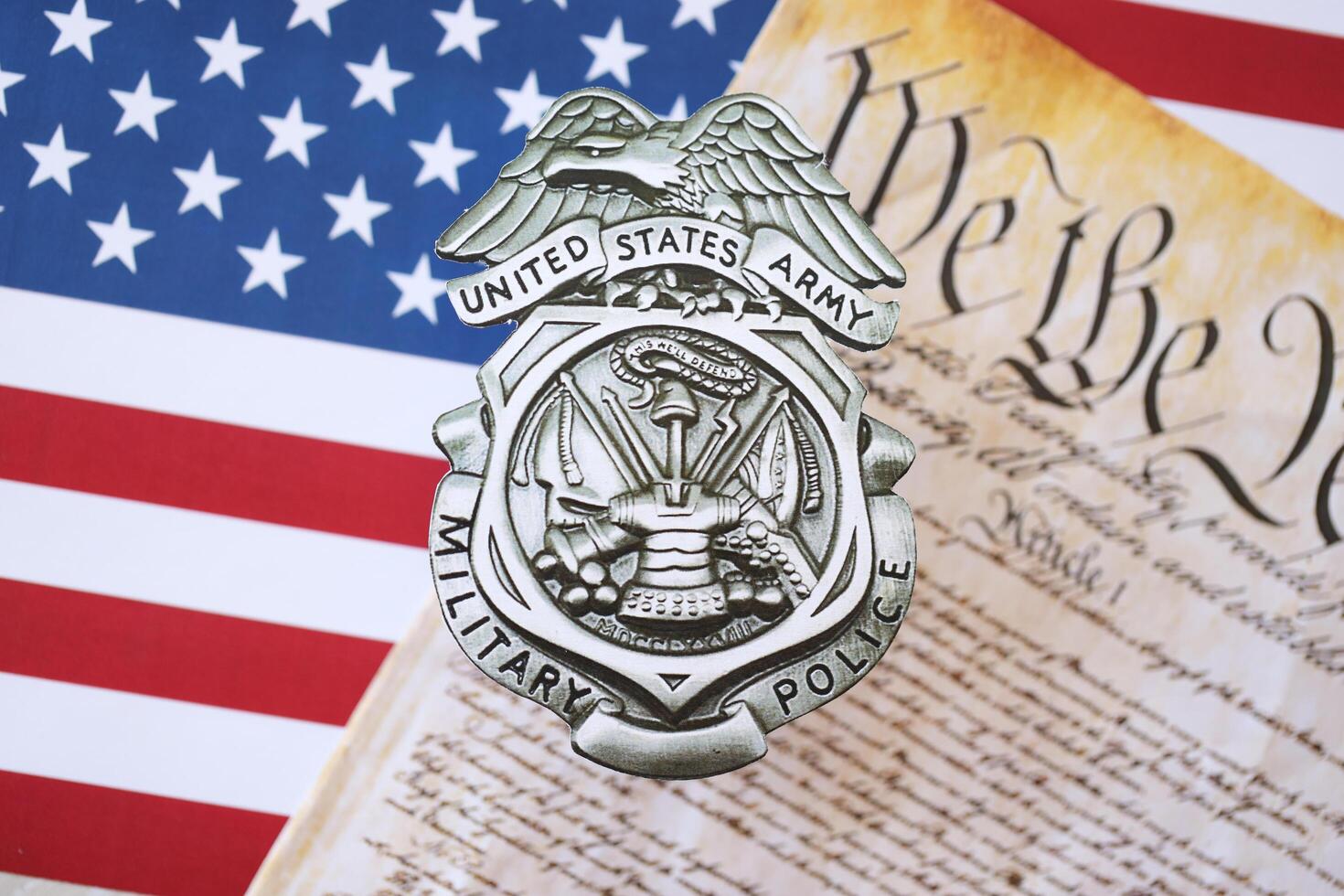 KYIV, UKRAINE - MARCH 9, 2024 US Army Military Police badge with United States Constitution on flag photo