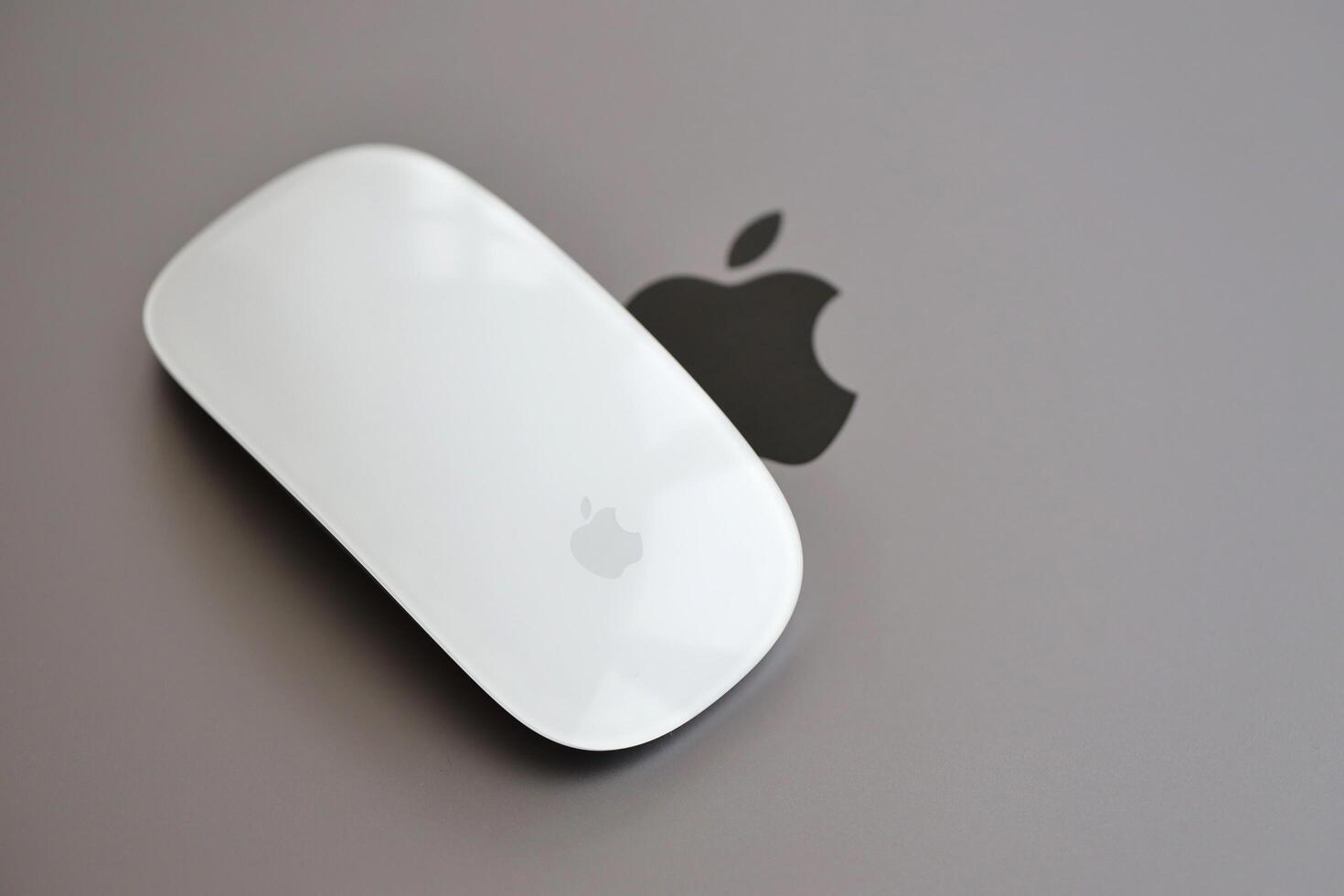KYIV, UKRAINE - NOVEMBER 27, 2023 Apple Magic Mouse 3rd generation lies with grey MacBook 2021 photo