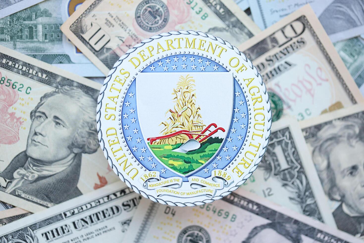 KYIV, UKRAINE - MARCH 9, 2024 US Department of Agriculture seal on many US dollar bills photo